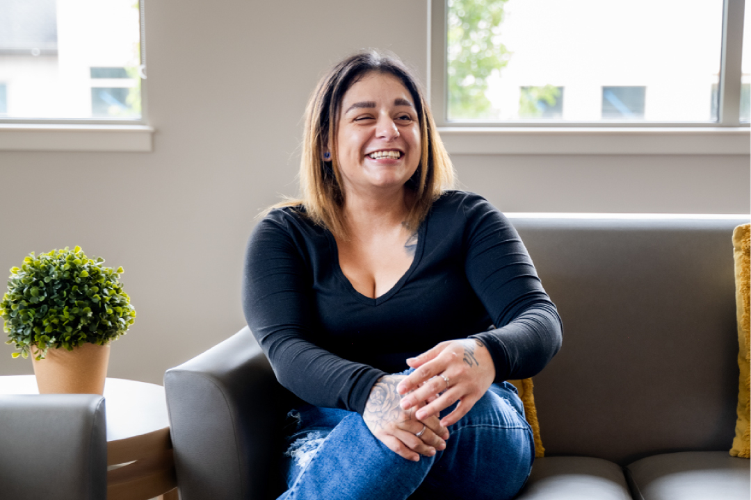 Samantha sitting on couch.